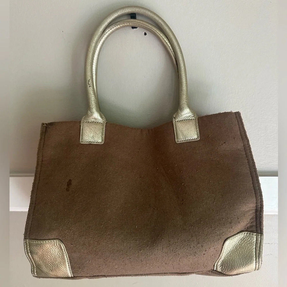Tory Burch Ella tote features a wool canvas body with gold leather trim & handle